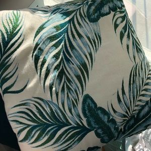 A pair of embroidered throw pillows